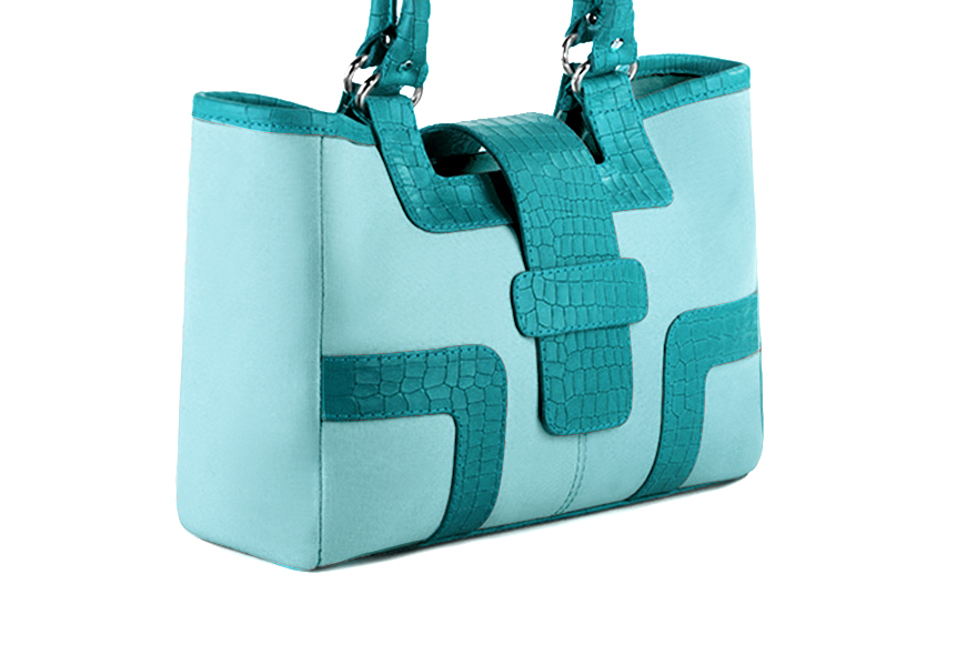 Handcrafted women's luxurious elegant handbag in premium aquamarine blue and turquoise blue leather. Perfect for elevated everyday style.   
                Choose from our luxurious collections of leather and fabric to perfectly match your handbags to your outfits.